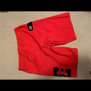 DC red swim trunks.